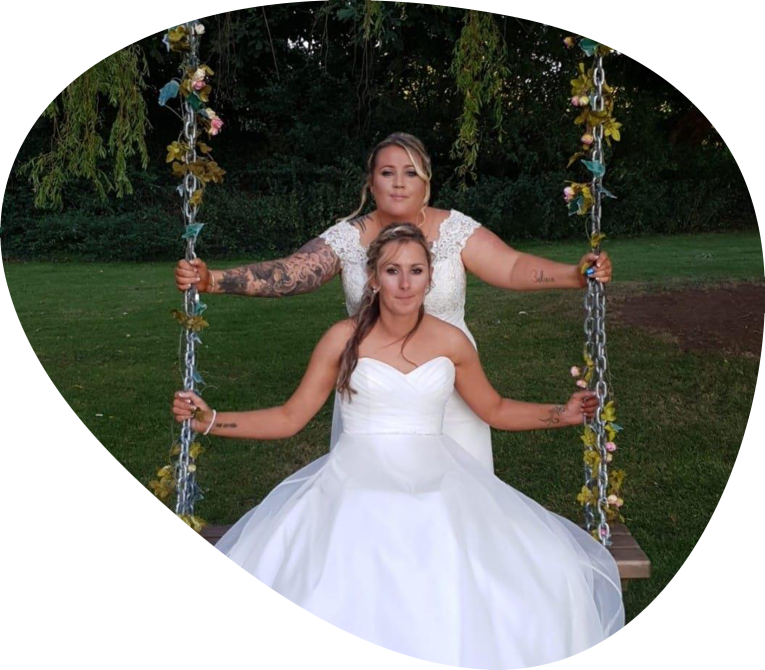 Mrs & Mrs Russell George looking amazing at their wedding held at Thornbury Golf Club